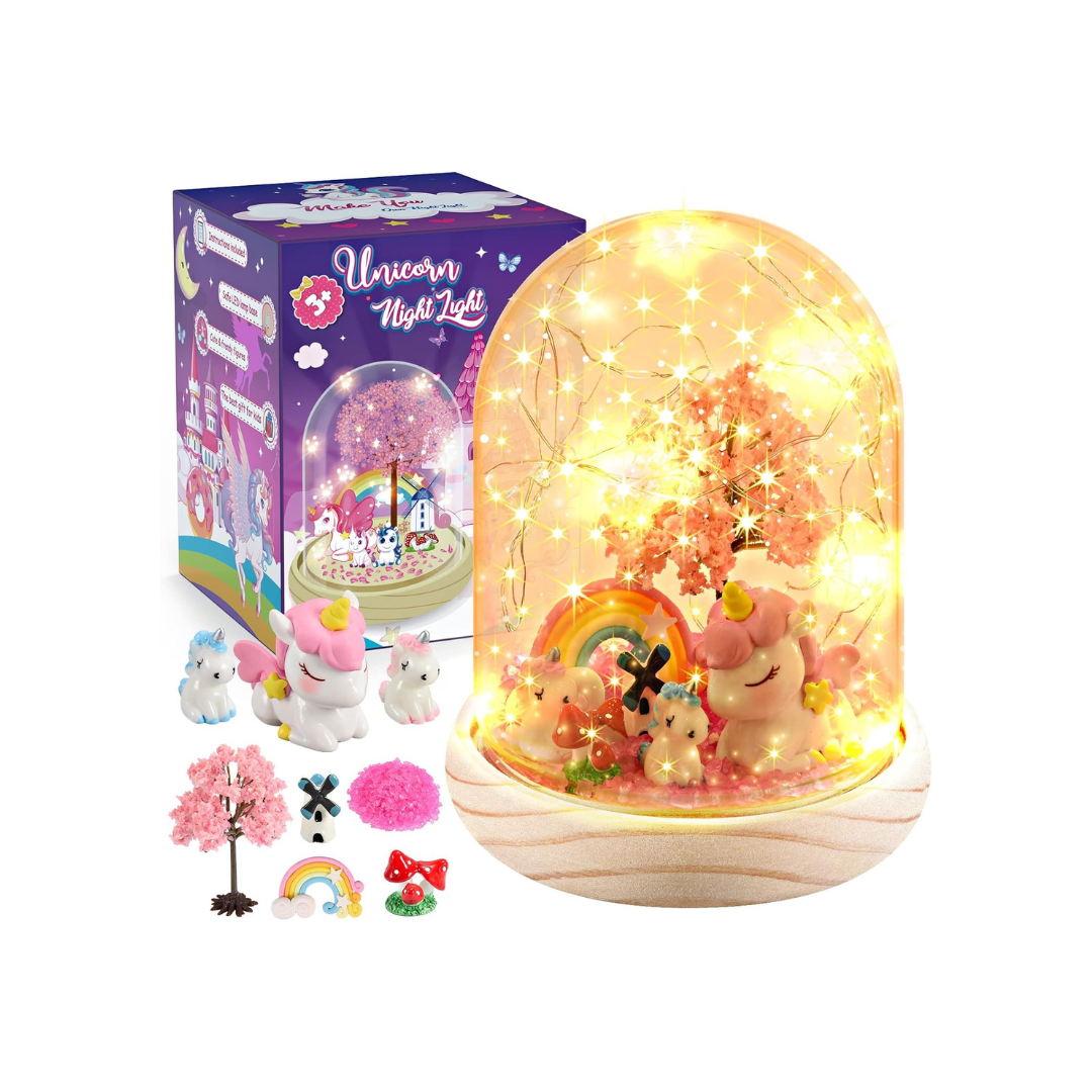 Unicorn night light with packaging and accessories on a white background