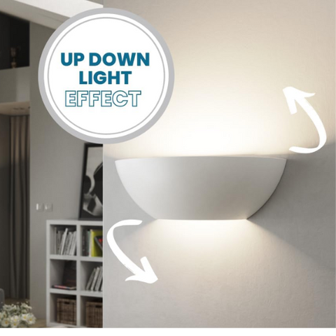 Full view of sleek half-moon wall sconce on living room wall


