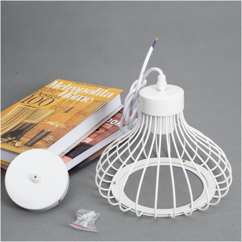 Vintage art cage pendant light hanging over a dining table.

