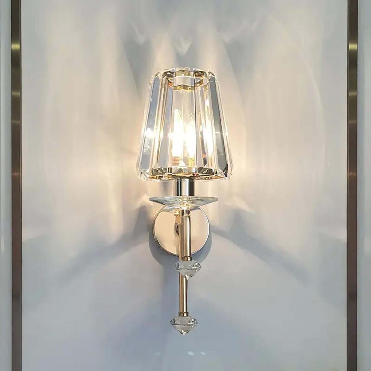 Wall-mounted lamp with crystal shade on a white wall