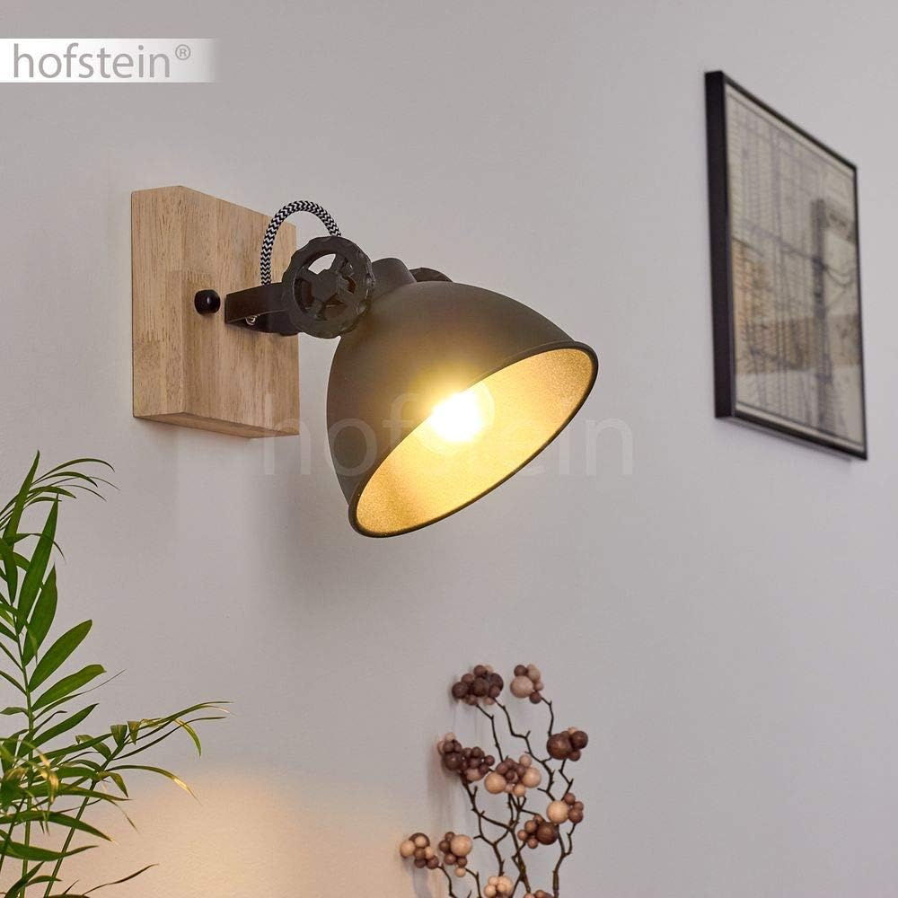 Wall-mounted lamp with wooden base and gold shade on a light gray wall, featuring the brand 'hofstein'.