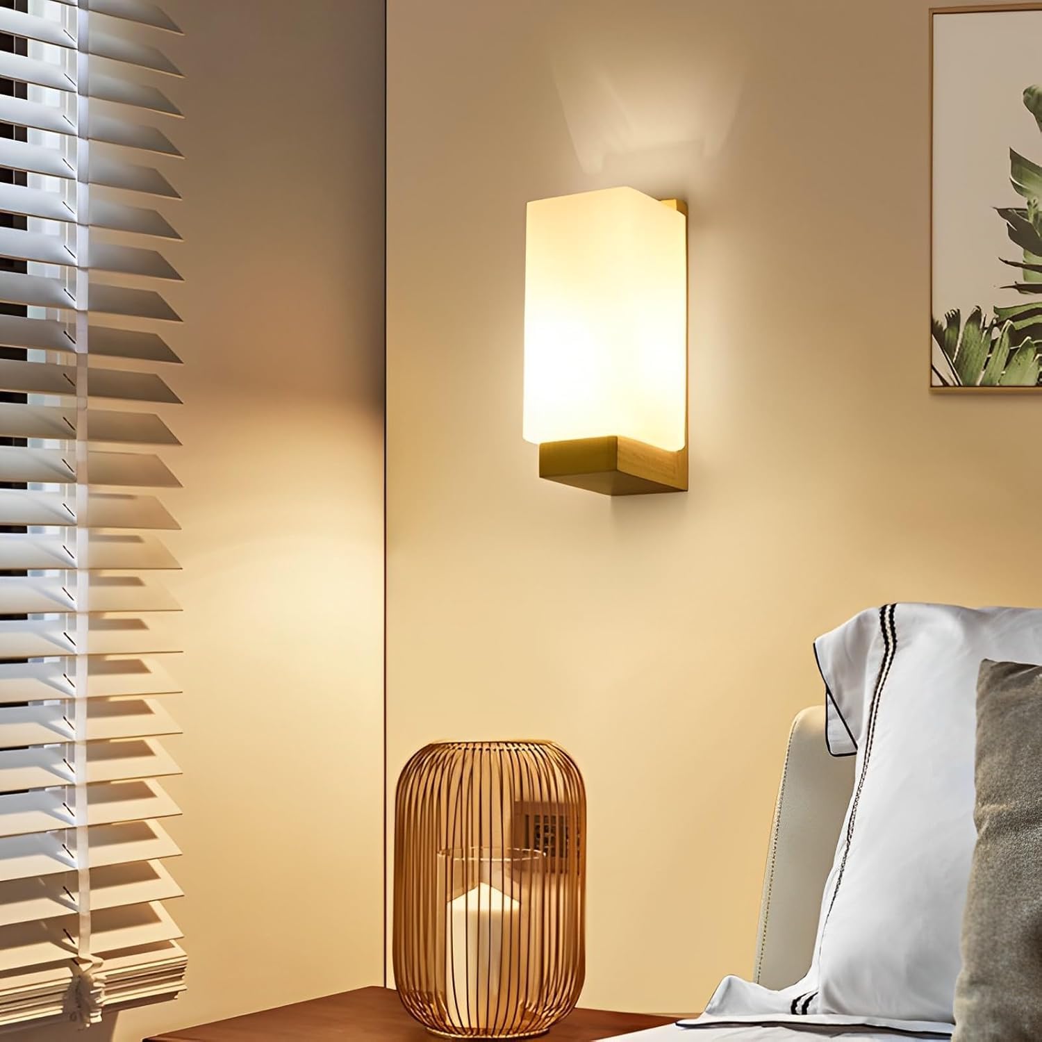 Wall-mounted light fixture on a wall with a lamp and chair in the foreground