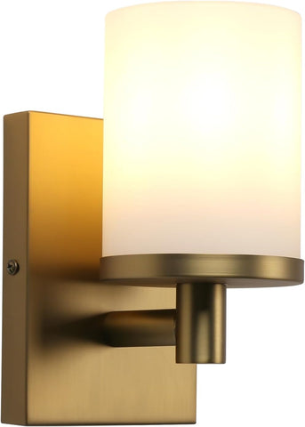 Wall-mounted light fixture with gold finish and white shade on a white background