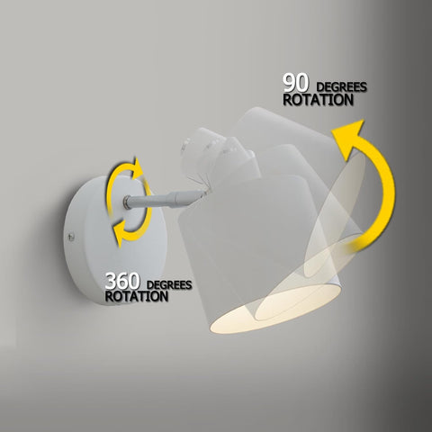 Wall-mounted light fixture with rotation capabilities on a gray background