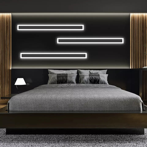 Elegant black aluminum wall light installed in a modern living room

