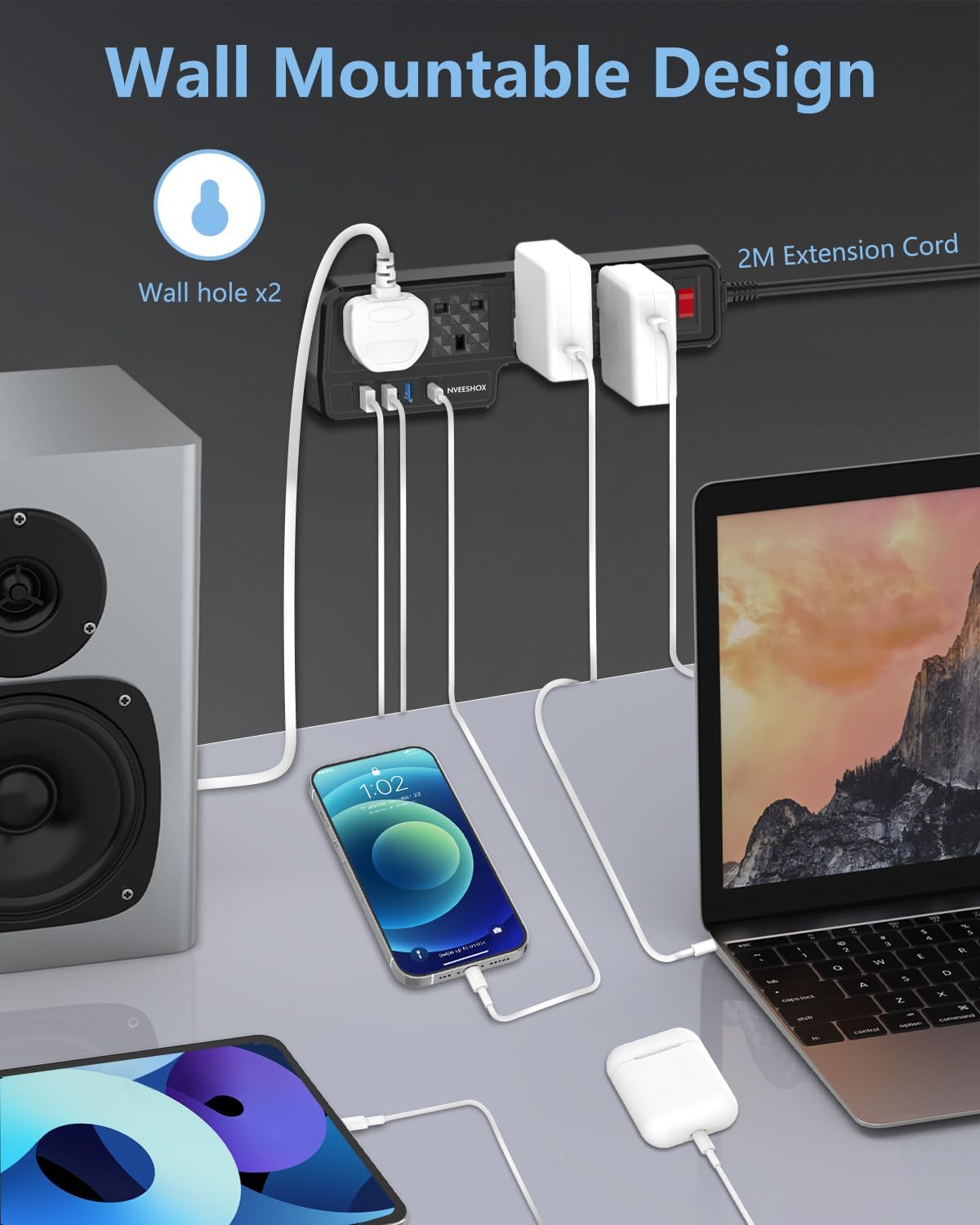 Wall mountable design with extension cord, laptop, smartphone, and speakers on a gray surface.