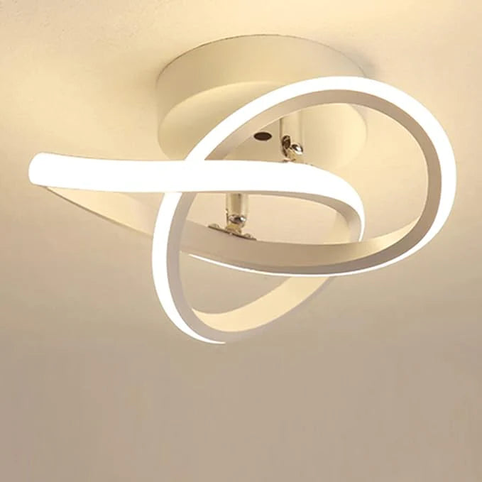 Modern ceiling light fixture with circular design on a plain background