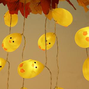 Warm white Easter chick LED lights draped on mantel for Easter décor