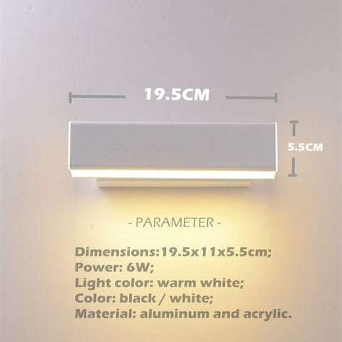  Energy-efficient LED wall light installed beside a bedside table