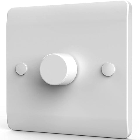 White light switch with three circular knobs on a white background