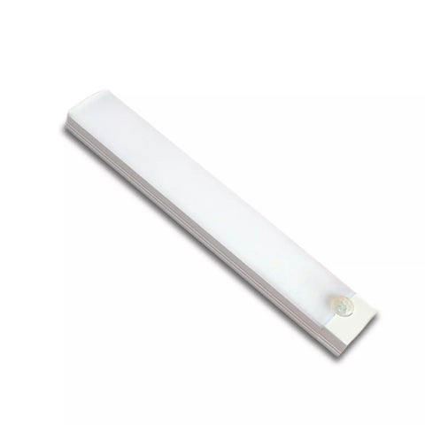 Wireless LED motion sensor strip light enhancing under-cabinet lighting in a modern kitchen.

