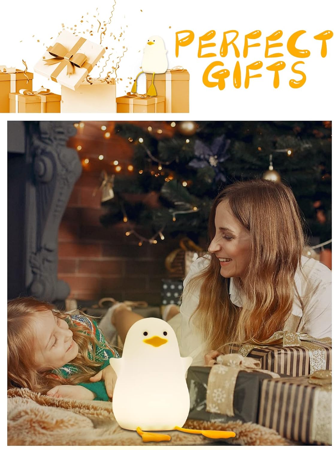 Woman and child with a penguin-shaped night light in front of a Christmas tree.