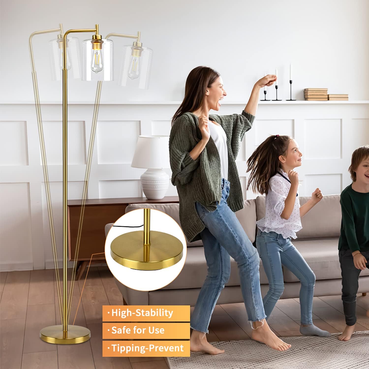 Woman and children playing in a living room with a gold floor lamp.