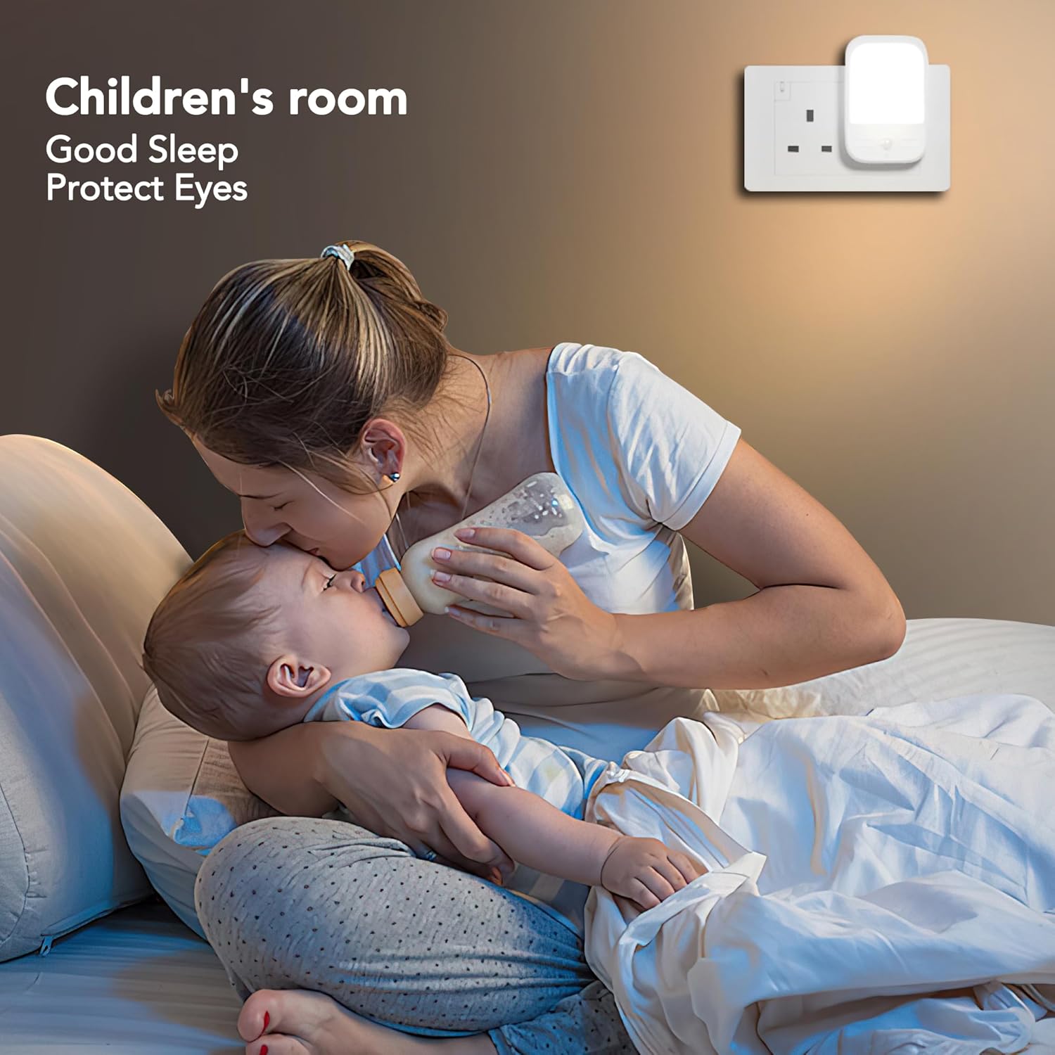 Woman feeding a baby with a night light on the wall in a children's room.