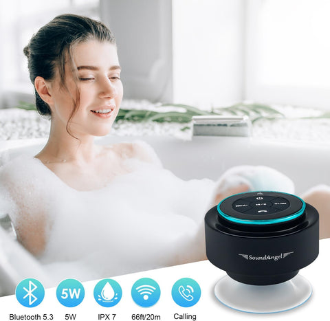 Woman in a bathtub with bubbles, holding a black Bluetooth speaker labeled 'SoundAngel'.