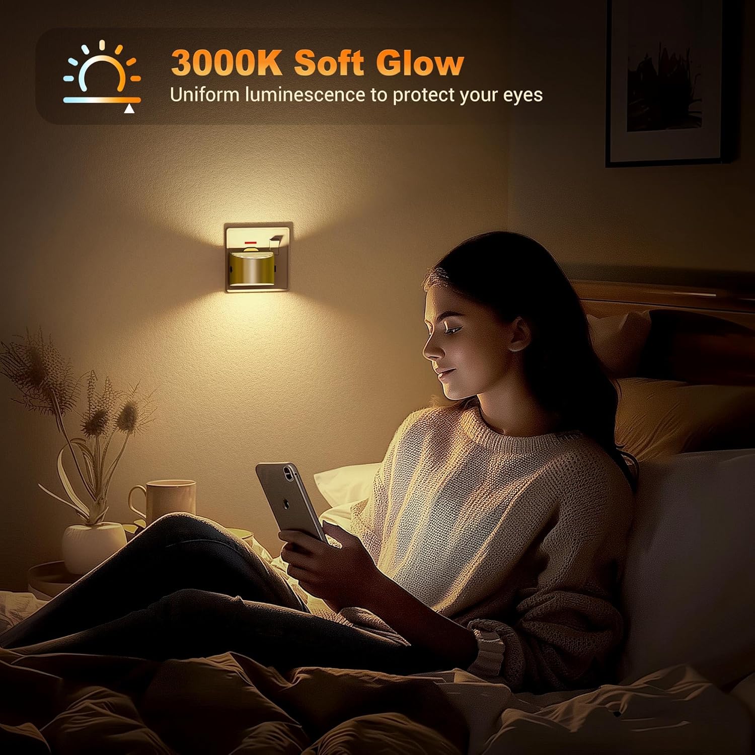 Woman sitting on a bed using a smartphone with a soft glow light fixture above her.