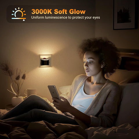 Woman using a smartphone in a dimly lit room with a wall light labeled '3000K Soft Glow'.