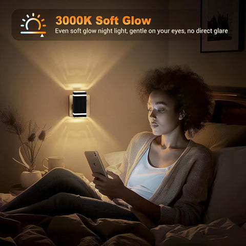 Woman using a smartphone in a dimly lit room with a wall light labeled '3000K Soft Glow'.