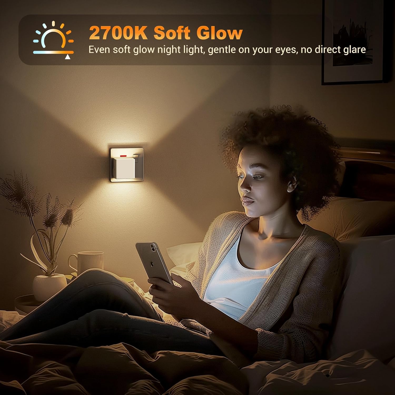 Woman using a smartphone in a dimly lit room with a night light on the wall.