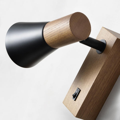 Wooden and black wall lamp on a white background
