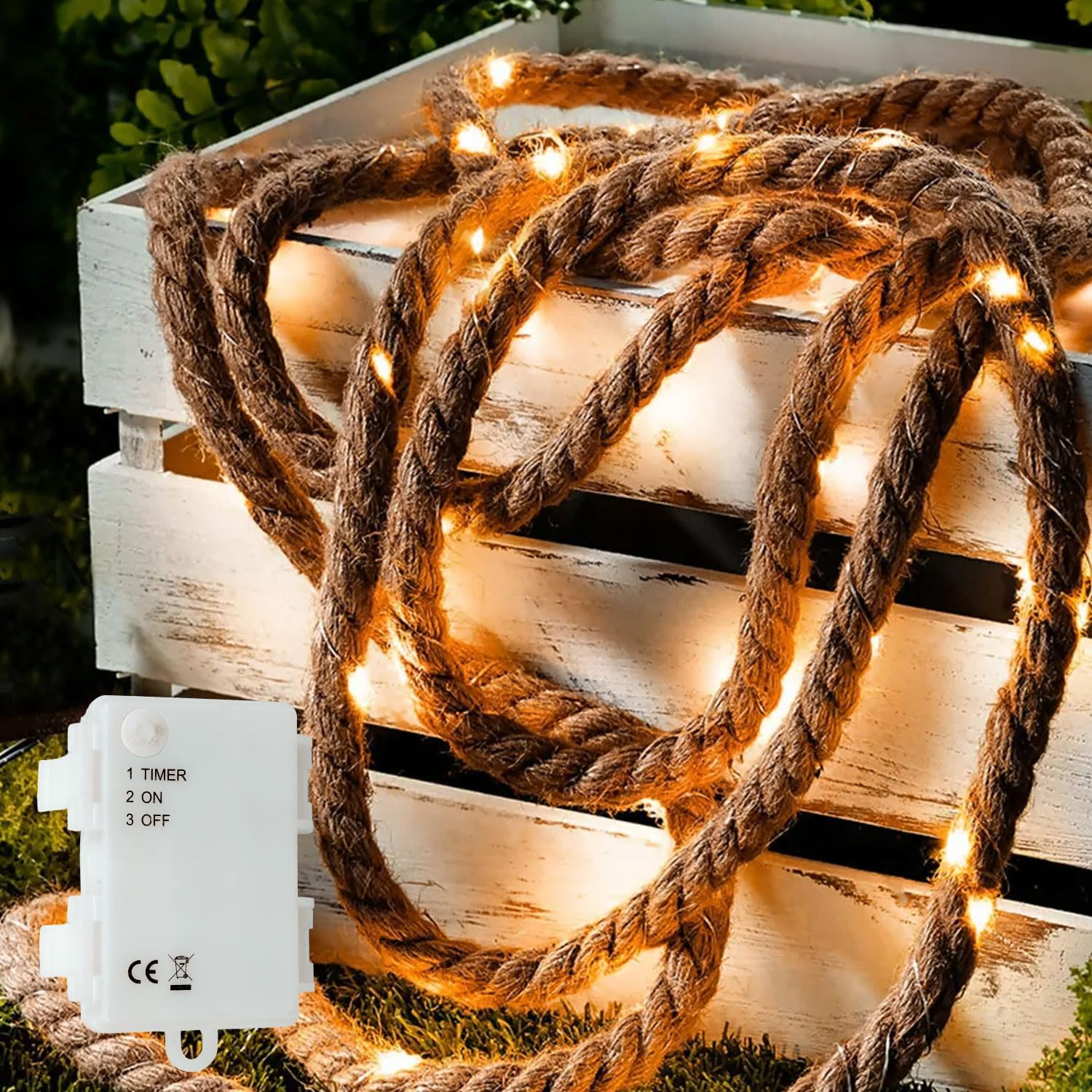 Wooden crate with rope and string lights on a grassy background