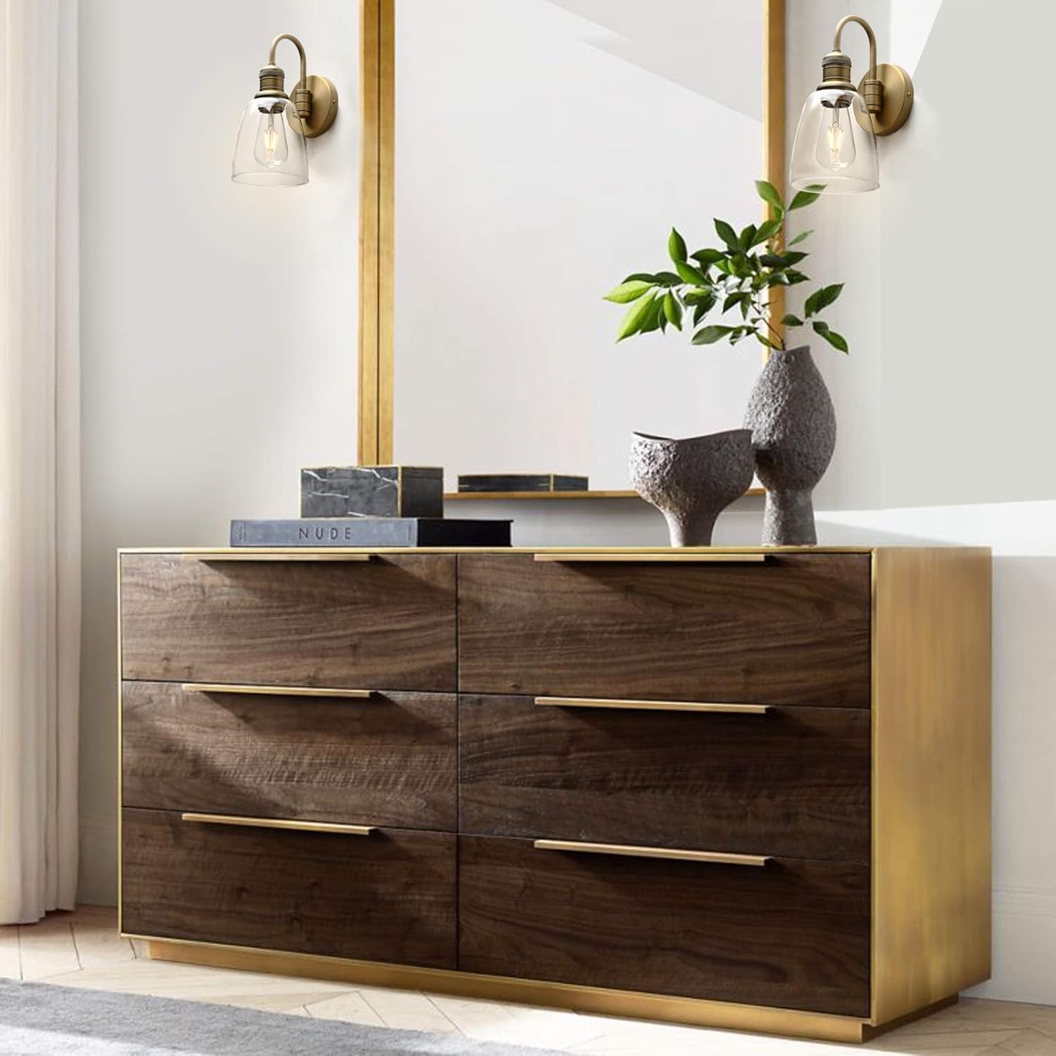 Wooden dresser with gold accents in a modern room setting