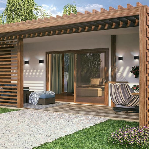 Wooden pergola with outdoor furniture and decor in a garden setting