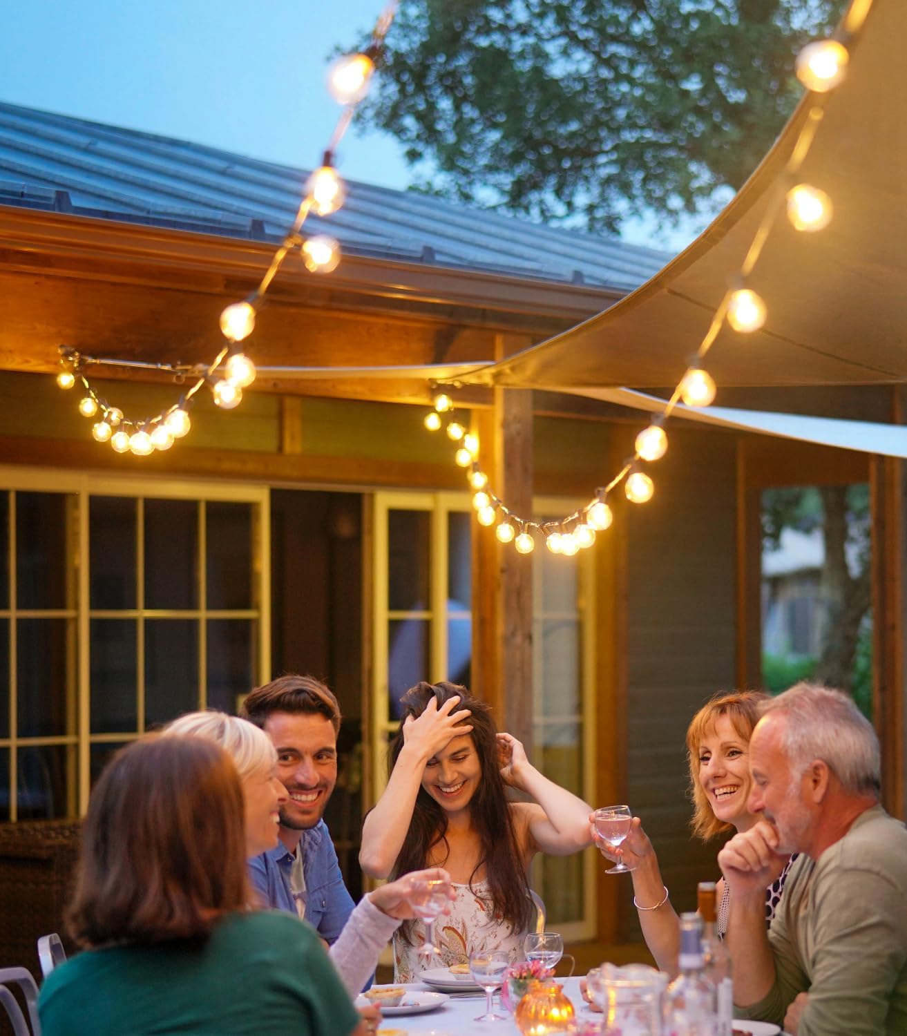 Energy-efficient G40 LED string lights illuminating outdoor café seating area
