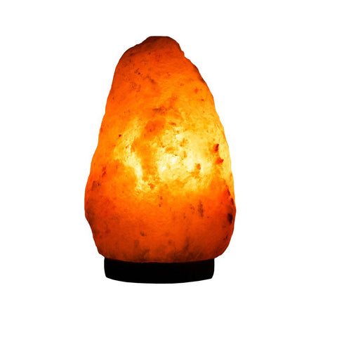 Himalayan salt lamp glowing softly in a cozy living room.

