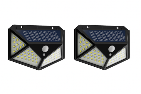 Two solar-powered motion sensor lights on a white background