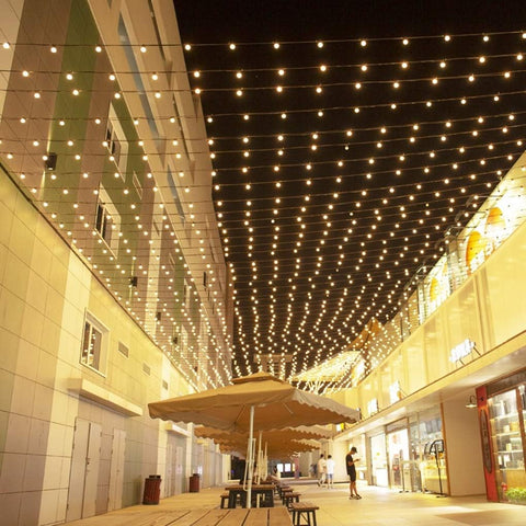 Festoon lights glowing in the rain, demonstrating IP65 waterproof rating