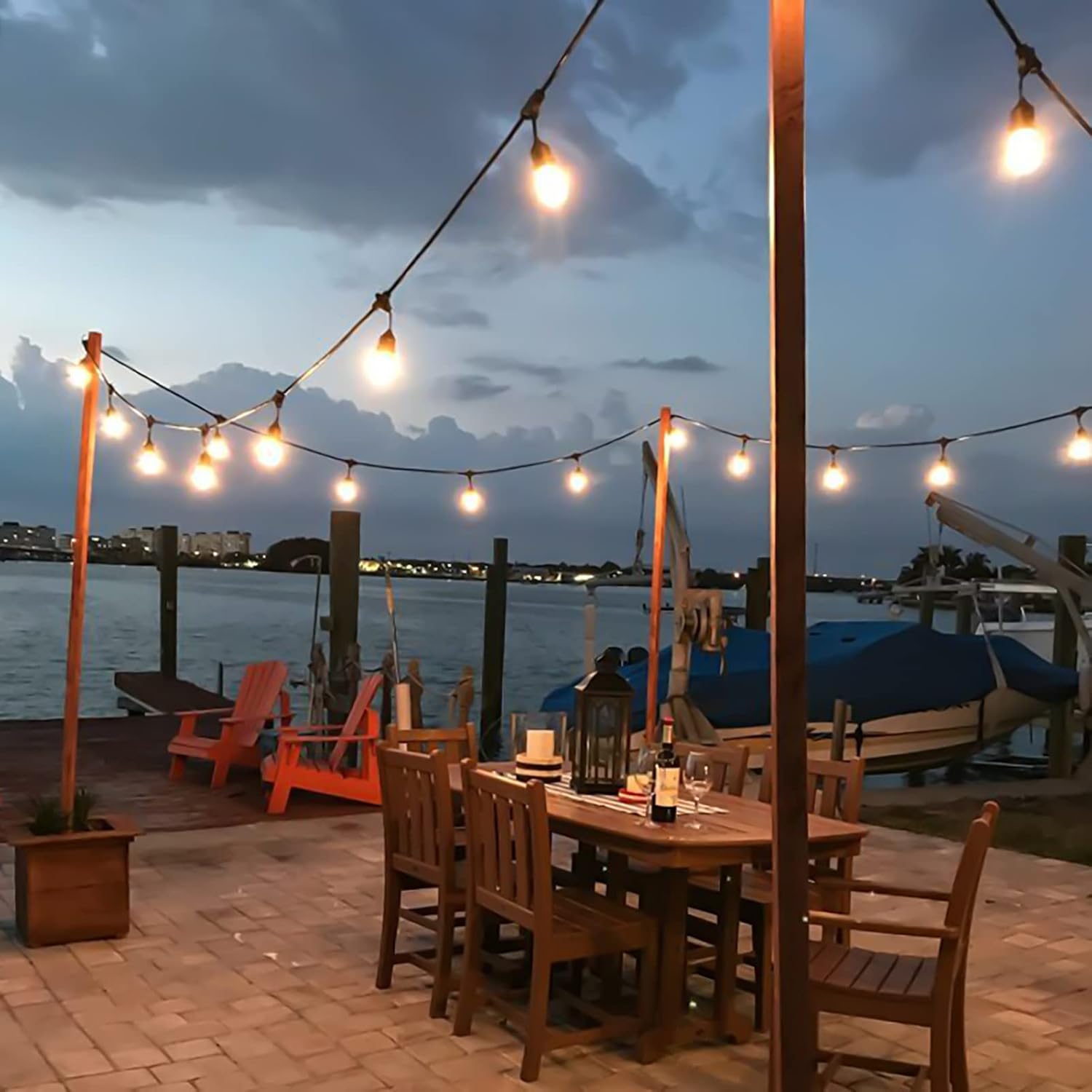 Patio decorated with 2700K festoon lights creating cozy evening ambiance

