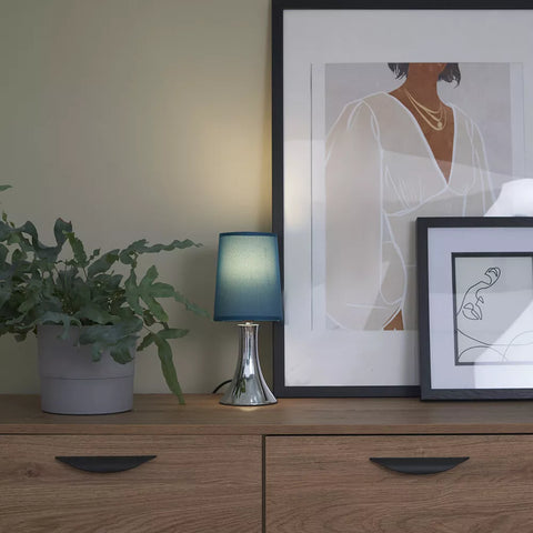 Lamp placed on a modern office desk.​

