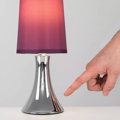Chrome Touch Table Lamp enhancing contemporary décor.​

