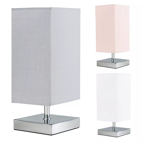 Chrome Square Touch Bedside Table Lamp with fabric shade on a bedside table.​

