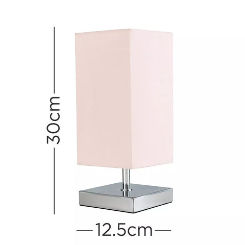 Lamp illuminating a cozy bedroom setting with adjustable brightness.​

