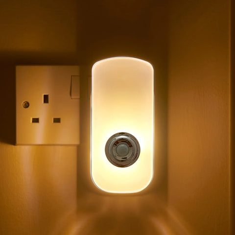 Automatic motion-activated night light providing warm white illumination


