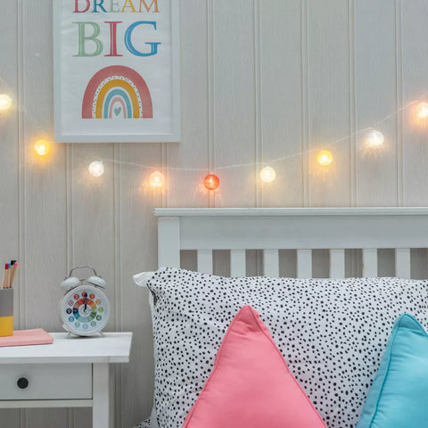 10 LED indoor ball fairy lights glowing softly in a cozy bedroom

