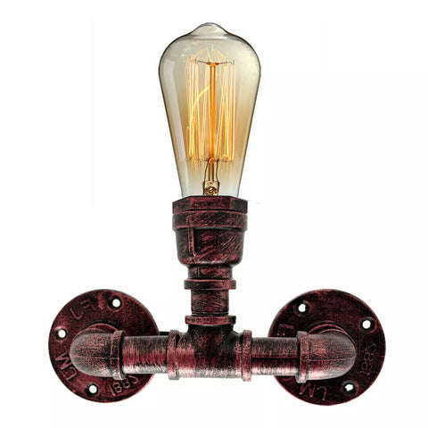 Handcrafted industrial wall light with a weathered metal finish, perfect for loft-style interiors.