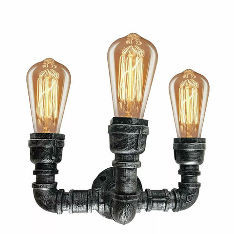 Rustic industrial pipe wall lamp mounted on a brick wall for a vintage aesthetic.