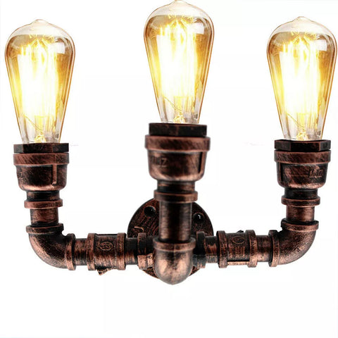 Steampunk-inspired water pipe wall light creating a warm, ambient glow in a cozy setting.

