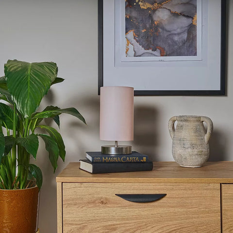 Compact LED desk lamp with dimmable function on study table – UK home office.

