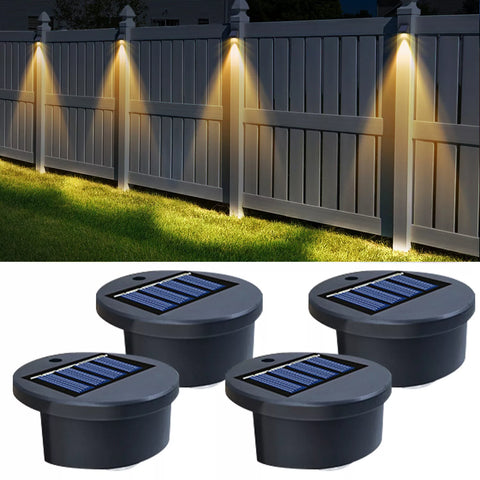 Solar wall lights illuminating a home's exterior at night.

