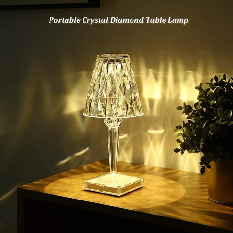 LED RGB Crystal Table Lamp displaying multicolour lighting on a bedside table.


