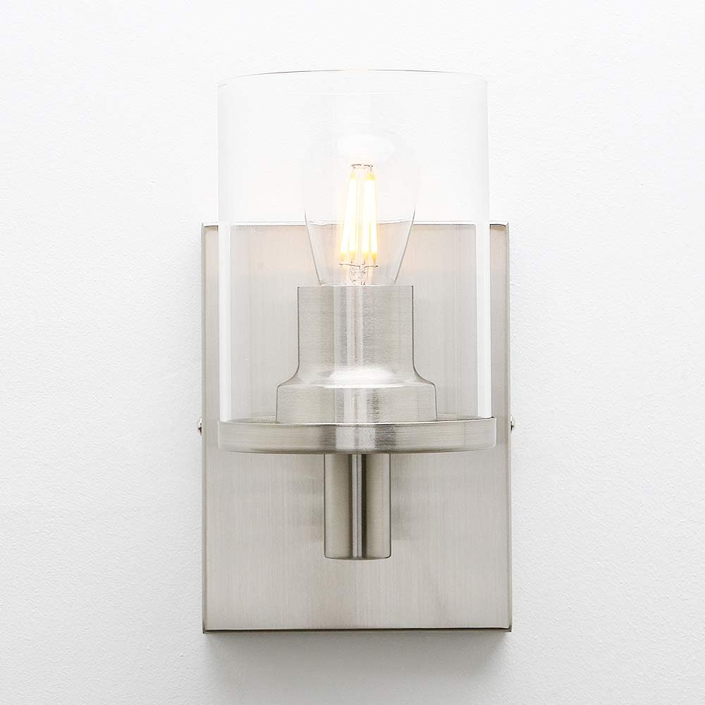 Modern wall sconce with glass shade on a white background